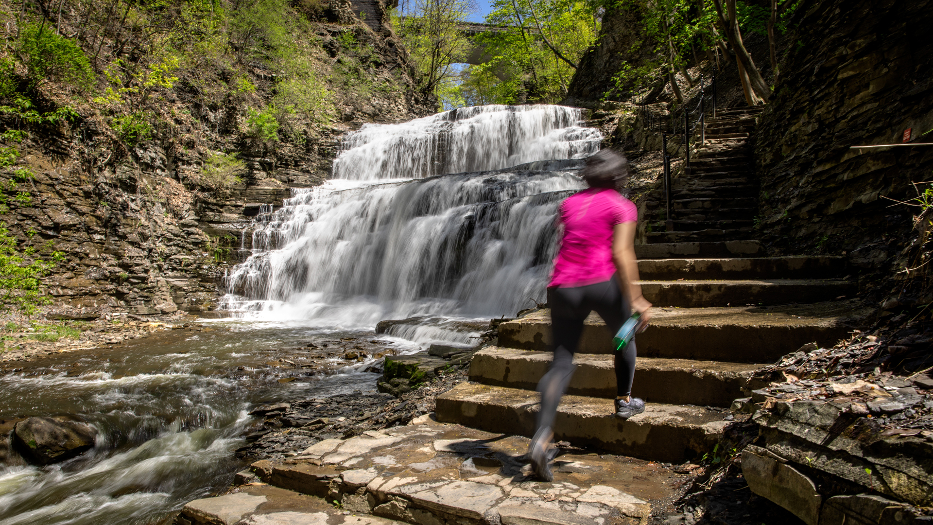 Woman hiking waterfall